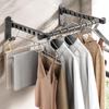Wall-Mounted Retractable Clothes Drying Rack - No-Punch, Invisible Folding Design for Bathroom and Balcony.