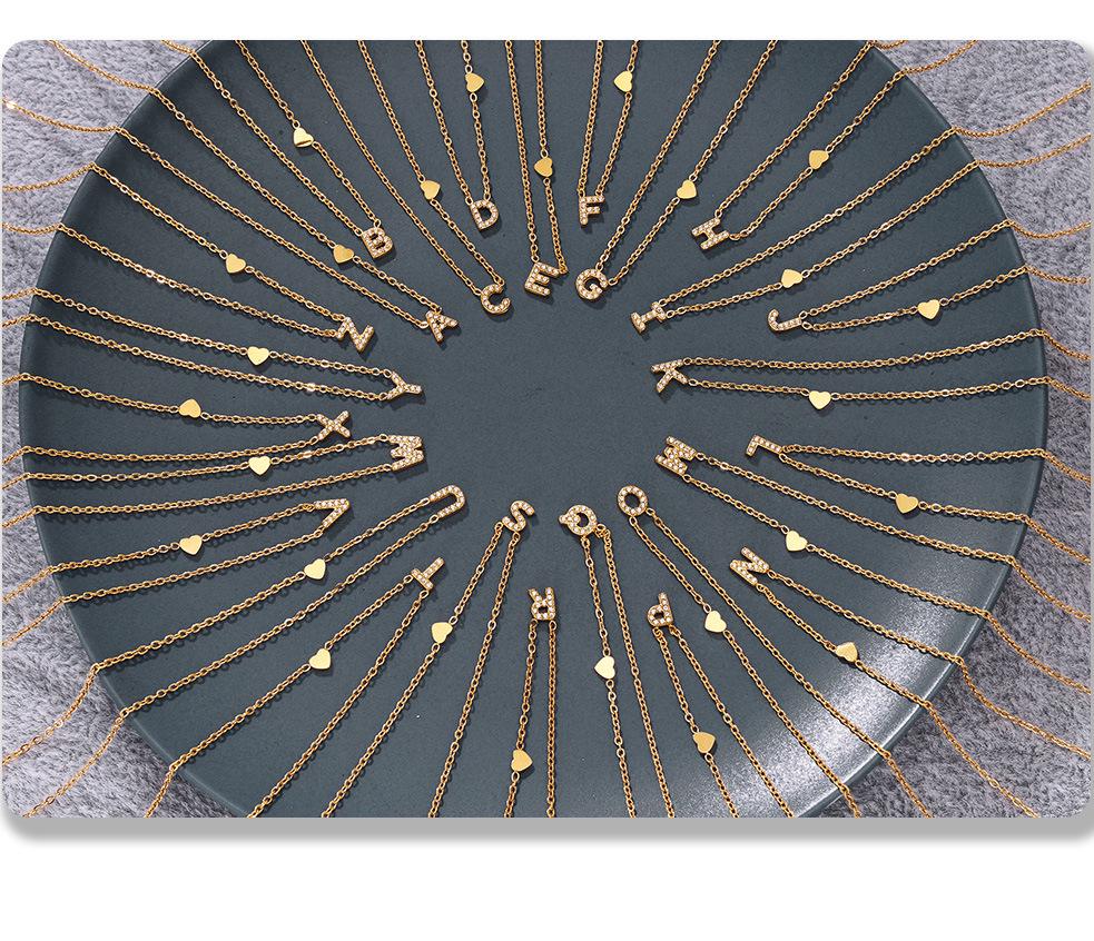 Oumeika Titanium Steel Jewelry Set: 26 Zircon-Inlaid Letters, PVD Gold-Plated Necklace, Bracelet, Earrings, and Ring.