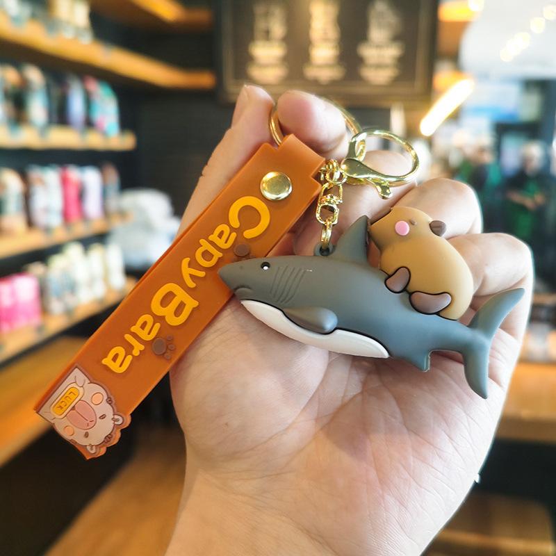 

7th Generation Bicycle Dolphin Shark Capybara Keychain Doll Machine Gift Premium Cartoon Cute Dolphin Hanging