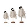 Three Halloween Are Placed On A Wooden Stand In The Center Of The Halloween Desktop For Indoor Decoration