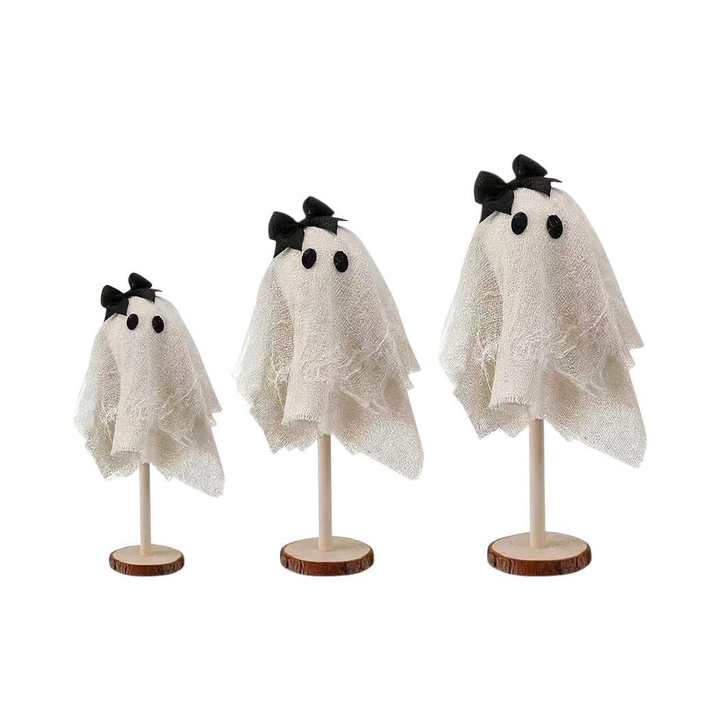 Three Halloween Are Placed On A Wooden Stand In The Center Of The Halloween Desktop For Indoor Decoration