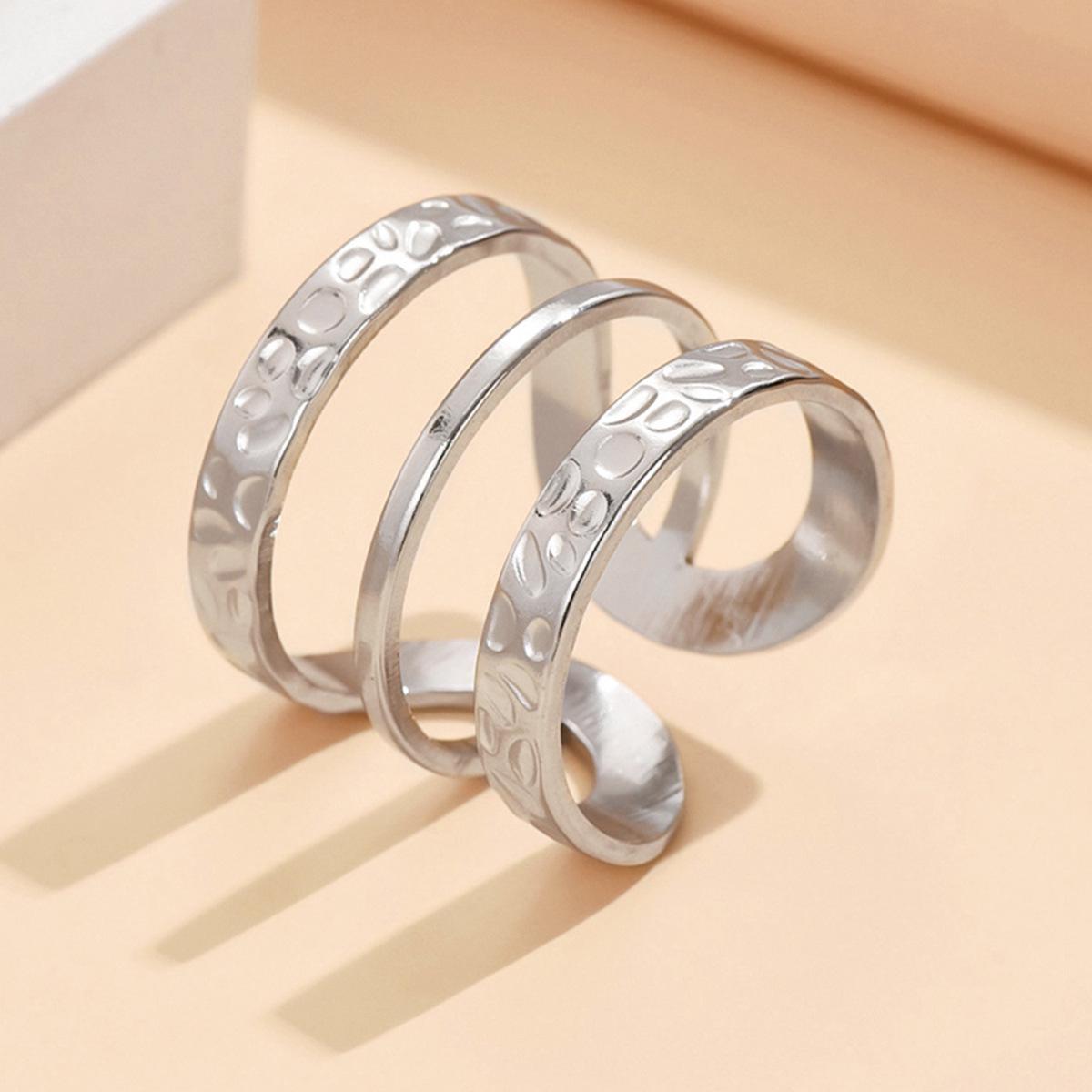 European  American Stackable Open Adjustable Stainless Steel Ring with Irregular Hammered Texture for Index Finger.