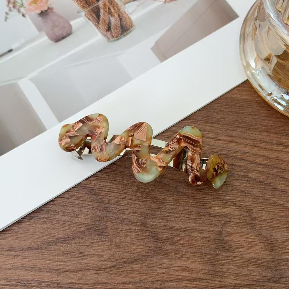 Koreanisches Temperament Hochwertige Goldmarke Unregelmäßige Kurve Acetat Feder Haarspange für Pferdeschwänze