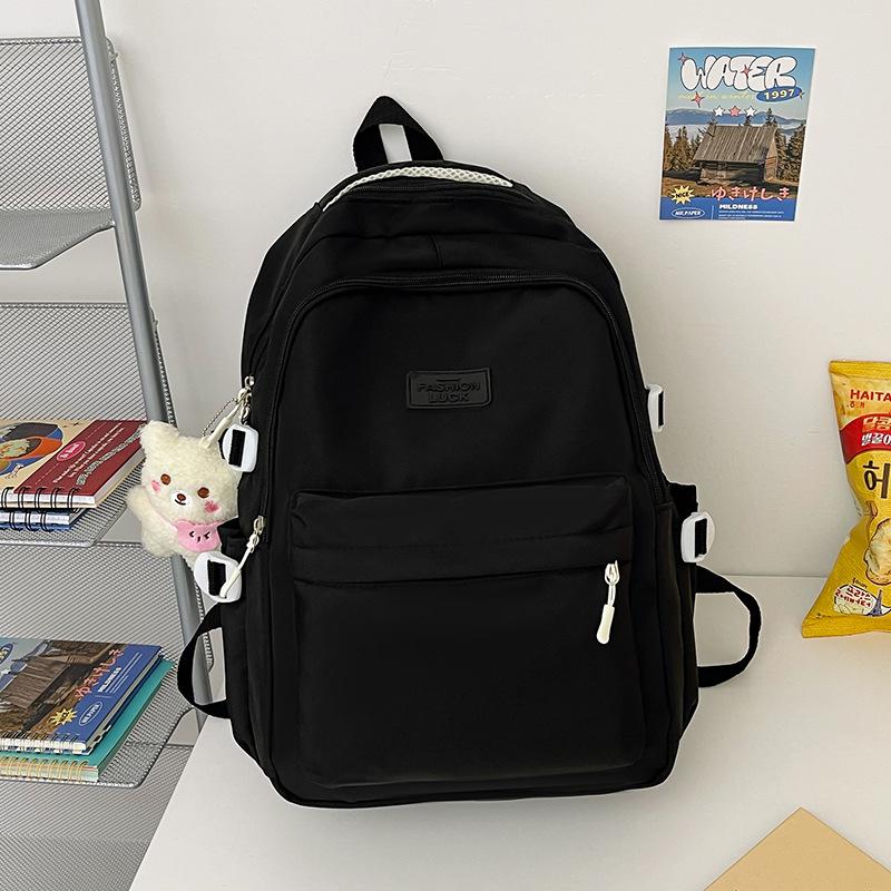 School bag female Japanese junior high school student high school student backpack female large capacity solid color simple computer bag backpack