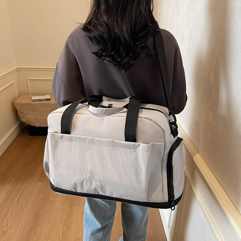 Portable light travel bag, men's and women's large-capacity duffel bag, short trip, shoulder messenger storage bag, fitness bag.