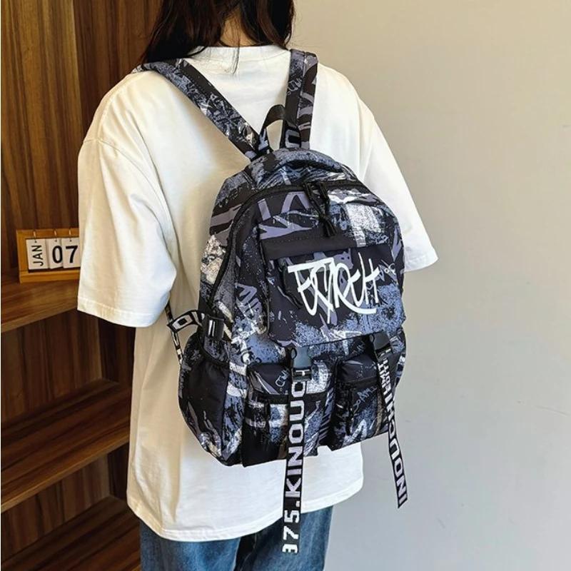 Přizpůsobený pánský nylonový graffiti batoh Velkokapacitní Všestranná verze Korejský cestovní batoh na krátké vzdálenosti pro počítač