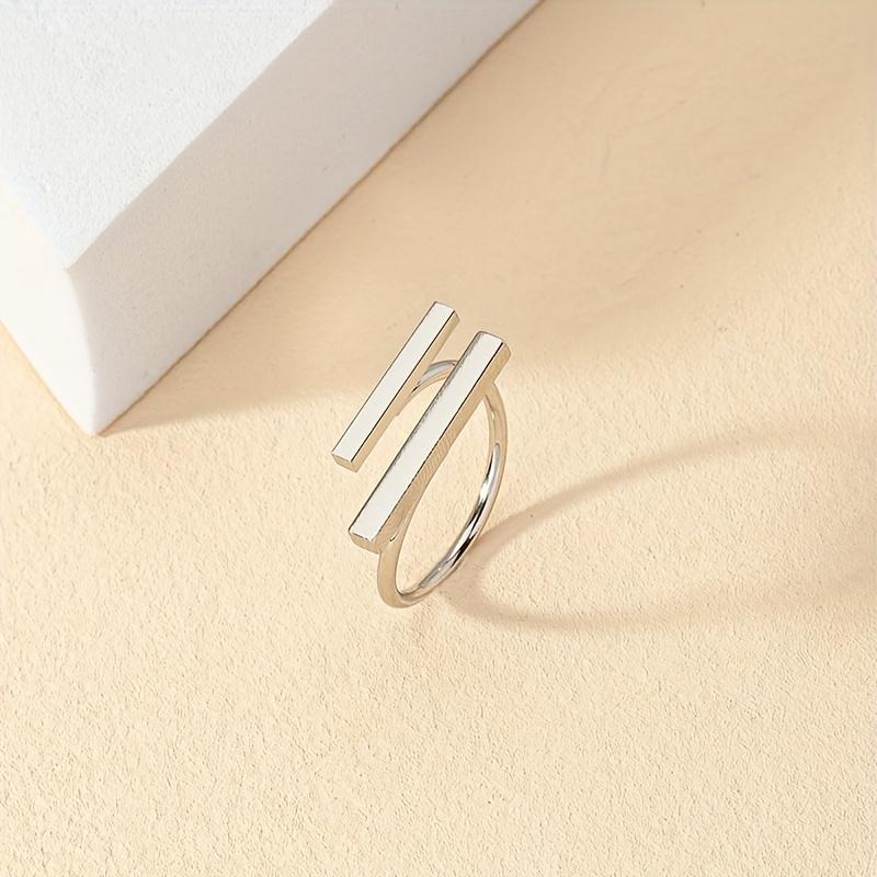 

A Minimalist Golden Ring With An Irregular Geometric Design And An Open End For Women.