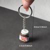 2 Stück Kreative Simulation Haselnuss Schokolade Marmeladenglas Flasche Schlüsselanhänger Paar Schlüsselanhänger Taschenanhänger Auto Schlüsselhalter Geschenke
