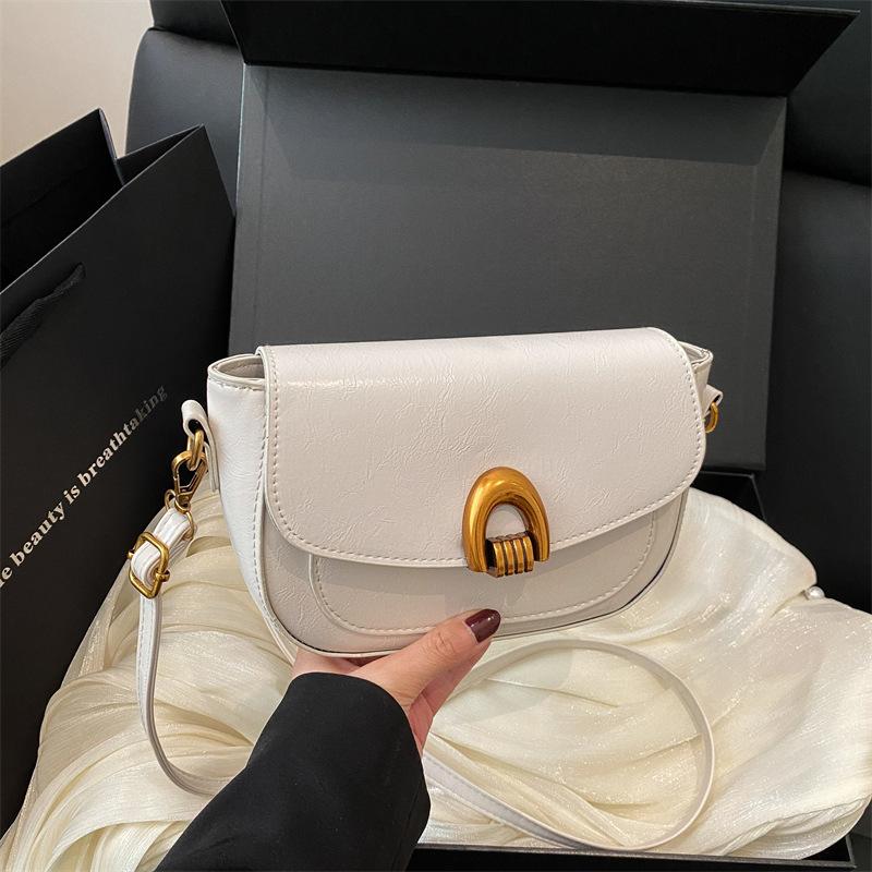 Saddle bag women's spring 2025 new clamshell shoulder messenger bag women's niche design underarm women's bag tide