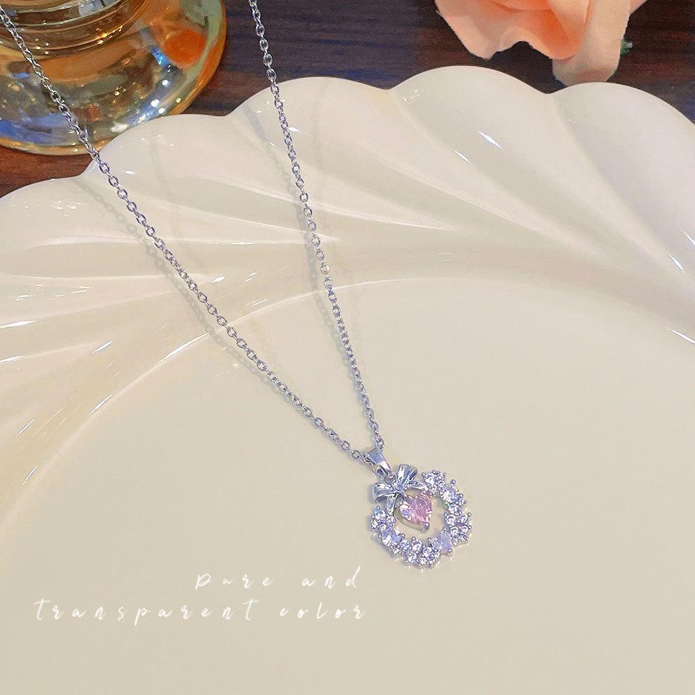 

Women s Japanese and Korean Christmas Bow Wreath Necklace with Pink Diamond Heart on Titanium Steel Chain