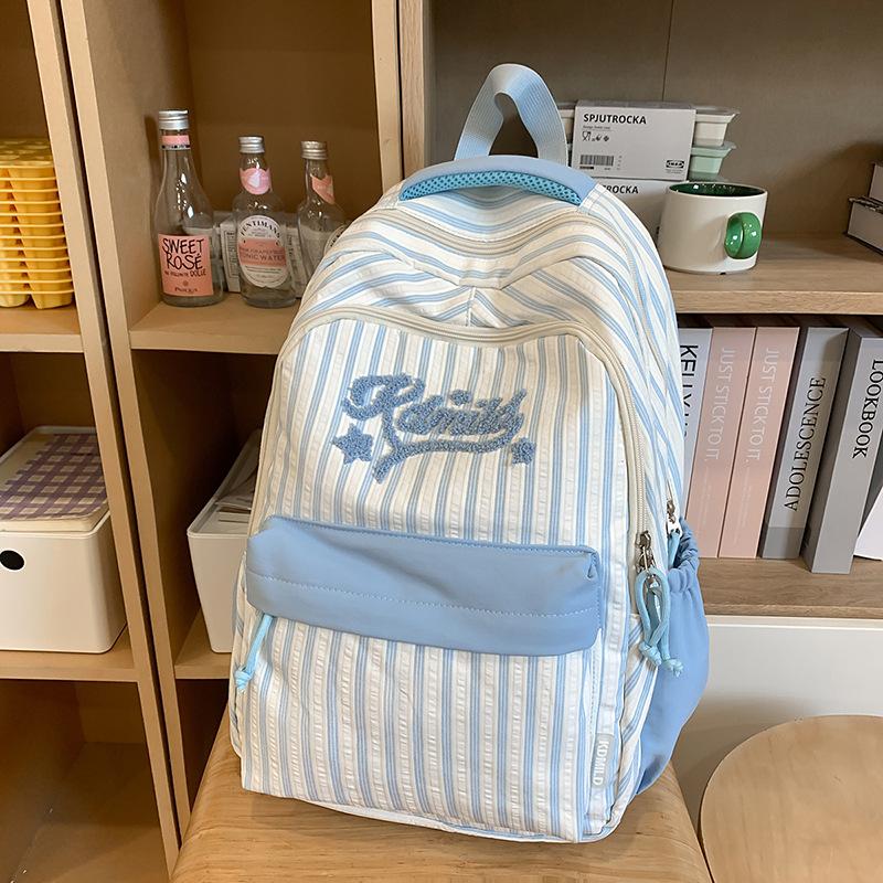 New high-value, fresh and sweet candy-colored striped backpack, high school student large-capacity backpack.