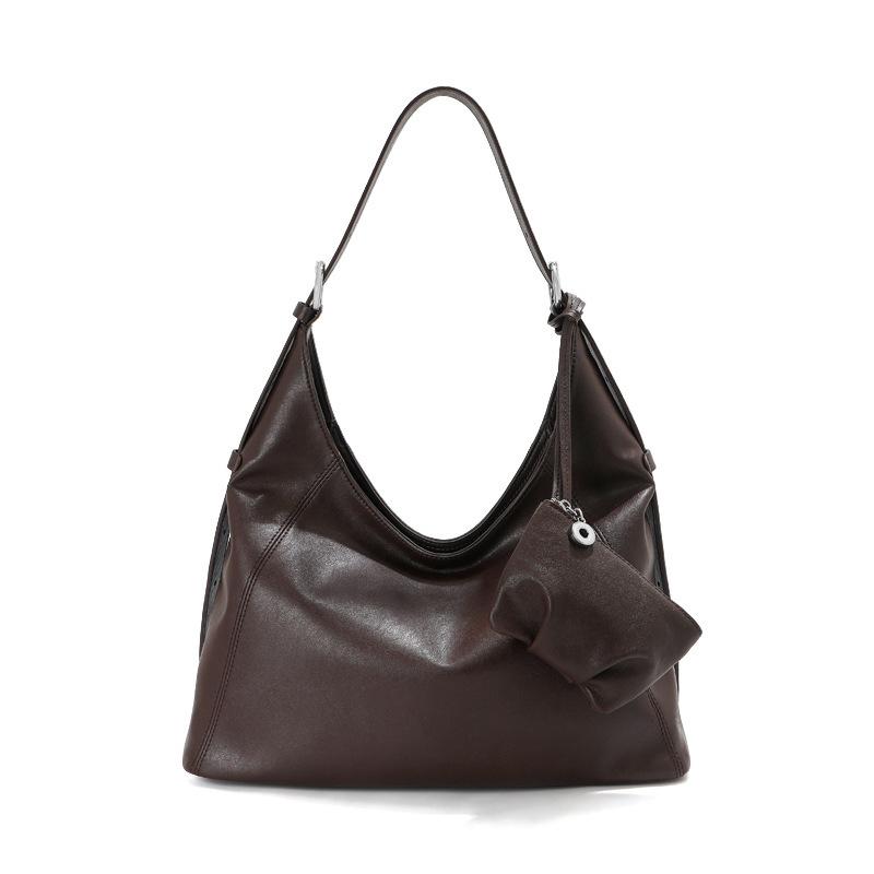 

Large capacity tote bag, soft leather first layer cowhide women s commuter armpit bag, premium leather, loose shoulder messenger bag. 33*12*21cm темно-коричневого кольору