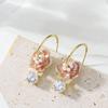 Korean version of gentle temperament fairy wind drip oil inlaid pearl camellia earrings light luxury high sense exquisite noble earrings