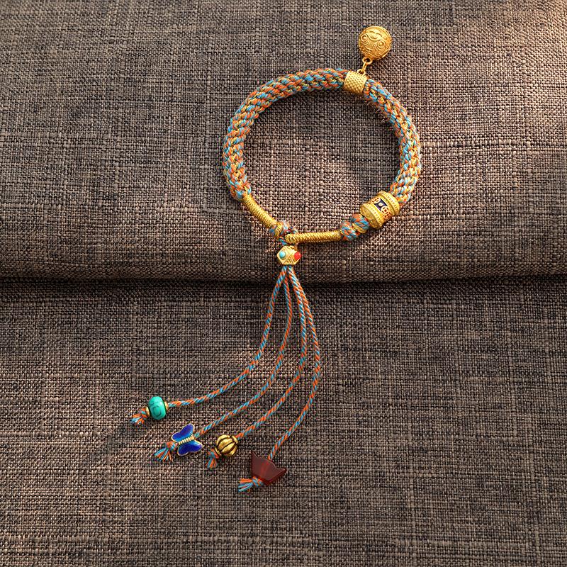 

Niche national style Tibetan hand rope ethnic style retro woven fringed colored bell bracelet Tibetan style accessories women