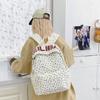 Schoolbag schoolbag female junior high school student high school student campus large capacity double shoulder floral letter ins style high niche 