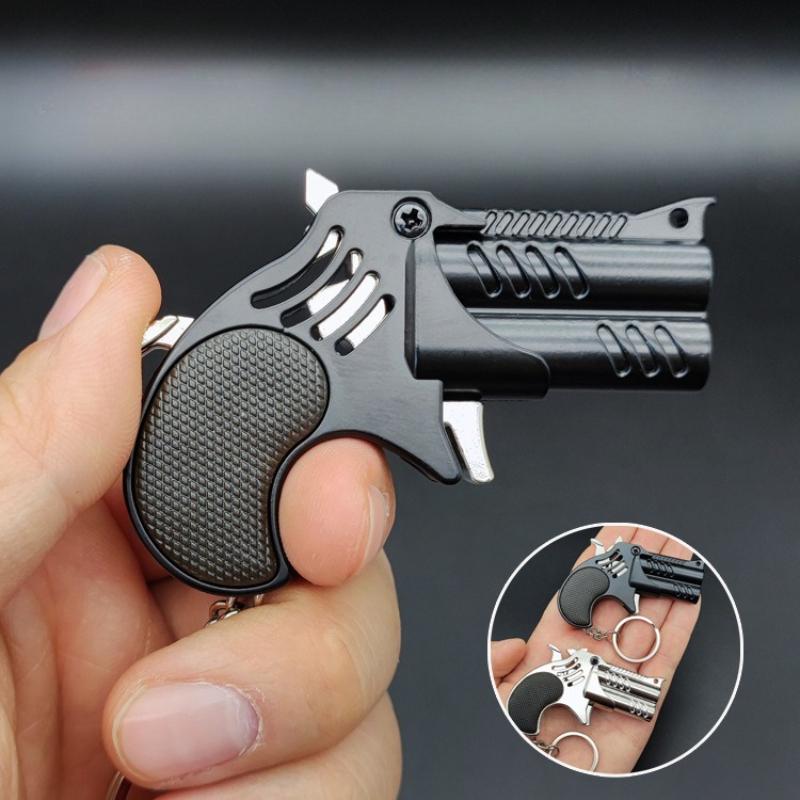 1 Pezzo Mini Portachiavi Metallo Elastico Giocattolo Pistola Gioco Pistola Lanciatore Pistola Simulazione per Adulti Giocattoli Regali Ciondolo