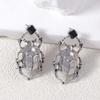 Exaggerated and retro minimalist alloy beetle earrings for women's daily commuting fashion