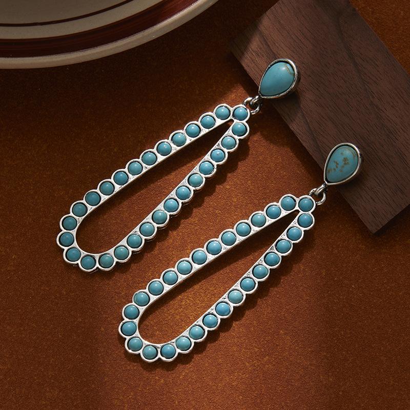 

Water Drop-Shaped Hollow Turquoise Earrings, High-End Women S Bohemian Style Earrings, Personalized Exaggerated Earrings.
