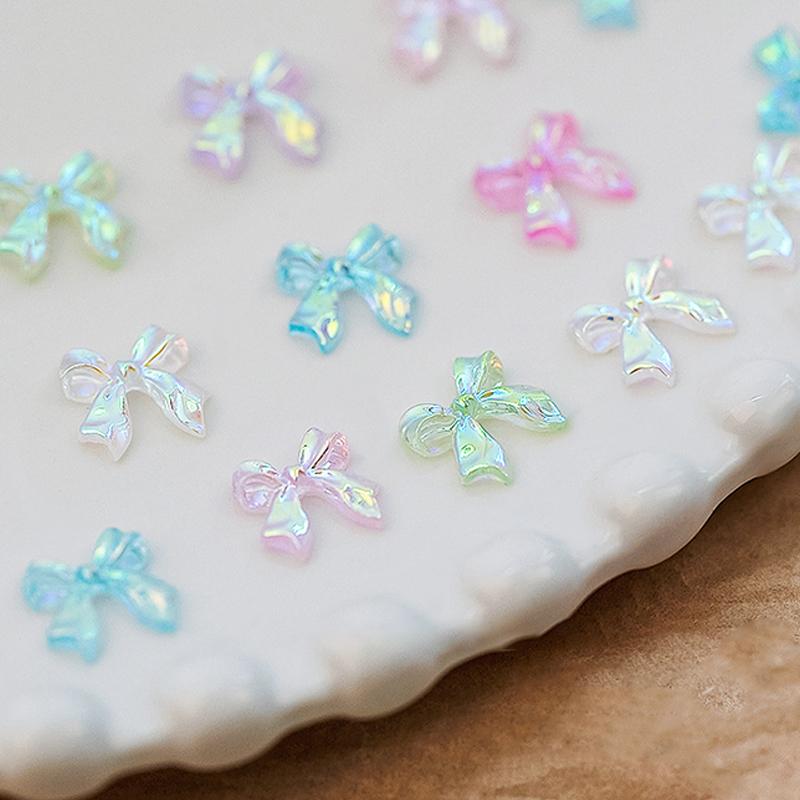 50 Stück Auroras Schleife 3D Nail Art Dekoration Harz Nagelanhänger Jelly Farbe Glitzer Nagelband Schleifen Schmetterling DIY Maniküre Salon