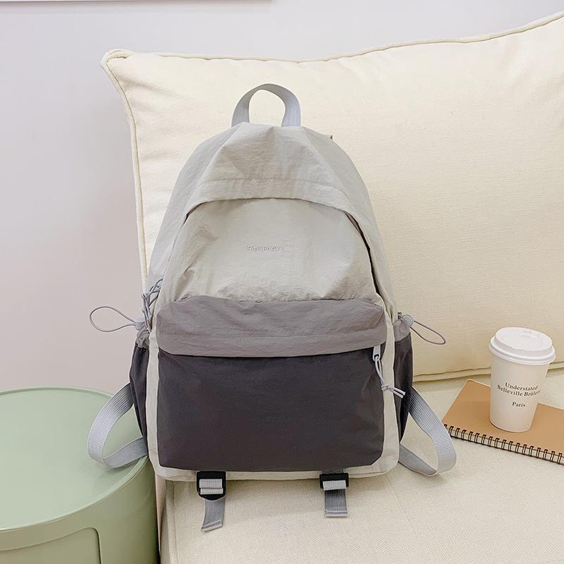 Outdoor lightweight backpack hiking waterproof mountaineering bag contrasting color college student schoolbag female computer bag tide