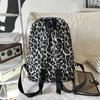 Leopard Print Backpack Casual Daily Use Trendy Street Style Lightweight Backpack for Women with Tassel Detail for School Travel and Everyday Outings
