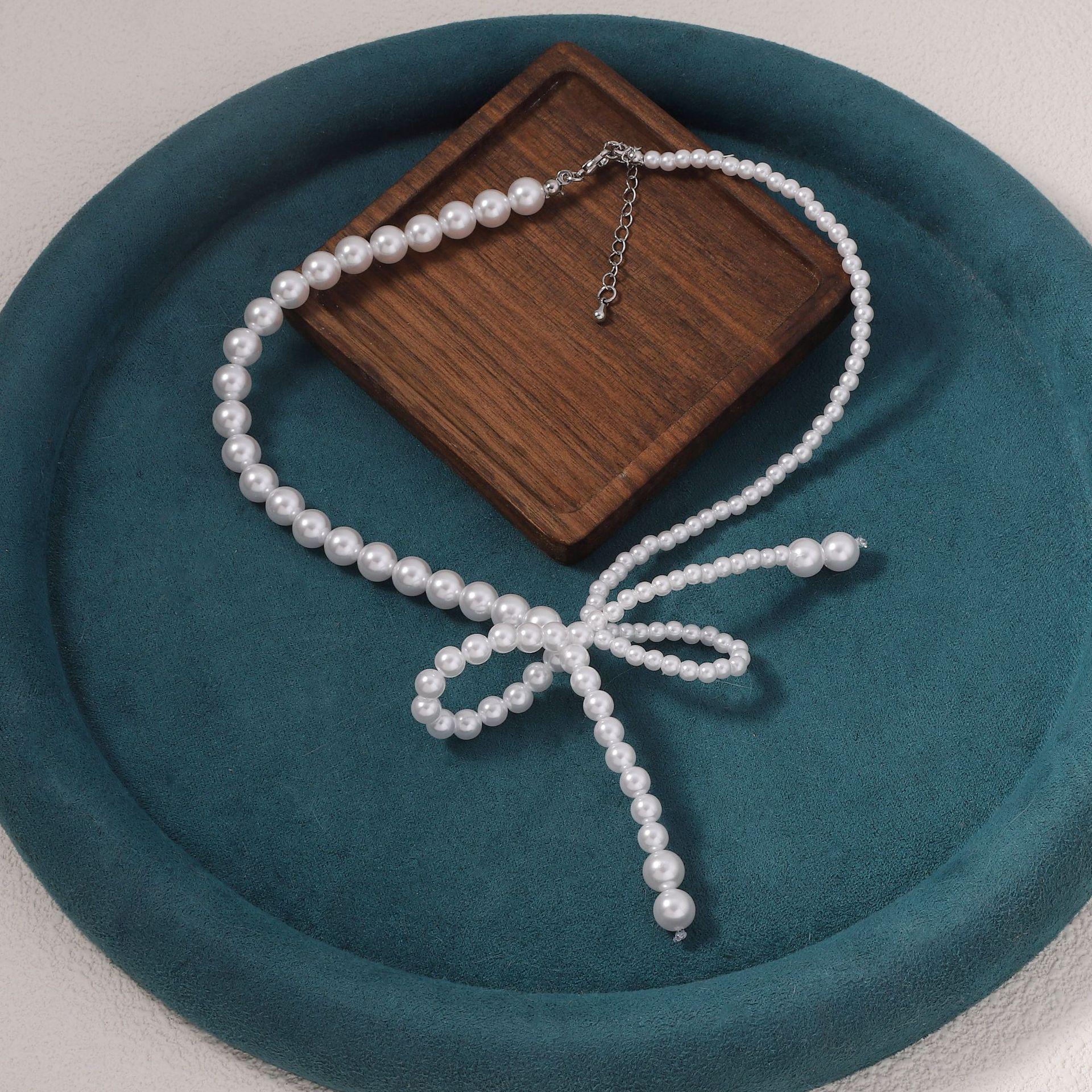 French light luxury asymmetrical pearl bow collarbone chain simple sweet cool elegant temperament fringe necklace