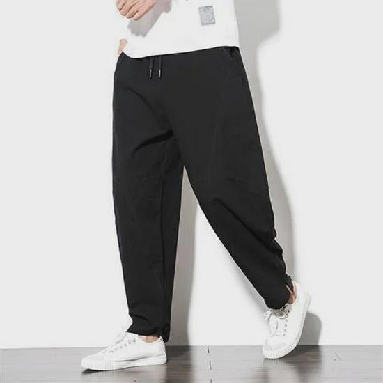 

Мужские льняные брюки больших размеров — свободный крой, повседневный стиль «шаровары», брюки-морковки с заниженным шаговым швом, смесь хлопка. L (115-130 kg) чёрный