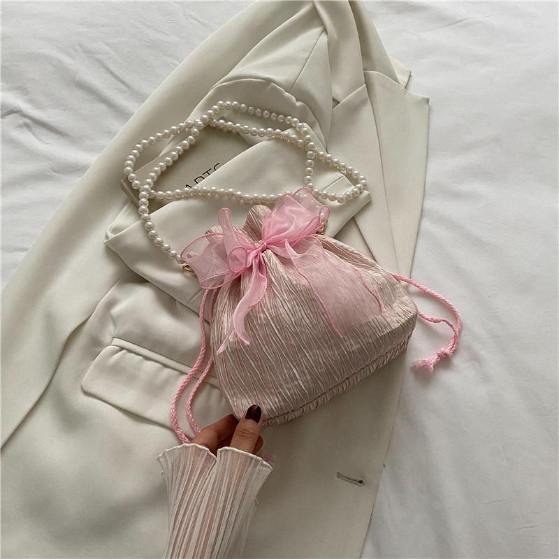 

Fairy pearl bag female 2025 new trendy fashion sweet bow bucket bag niche versatile messenger bag рожевий