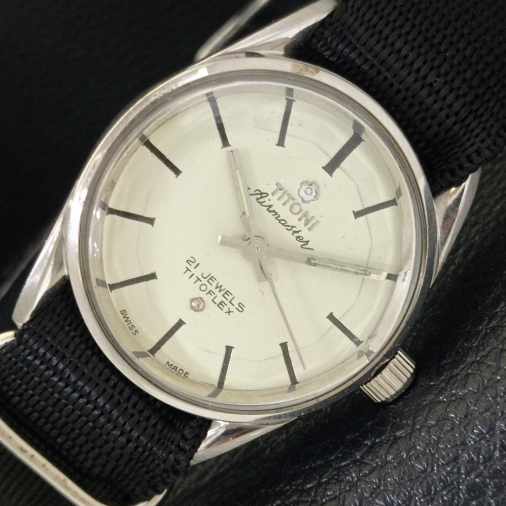 

ВИНТАЖНЫЕ ШВЕЙЦАРСКИЕ МУЖСКИЕ ЧАСЫ TITONI AIRMASTER TITOFLEX С РУЧНЫМ ЗАВОДОМ БЕЛЫЕ a702033-5 R208-a702033