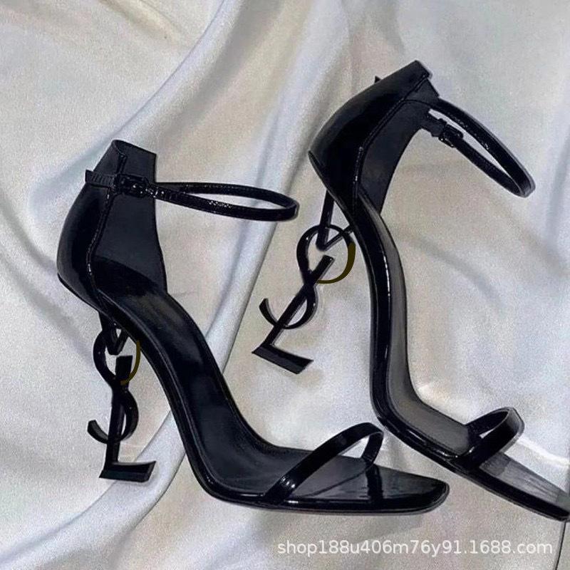 

[Spot] One-word sandals women s 2025 summer new sexy versatile letter buckle open-toed black stiletto shoes 34