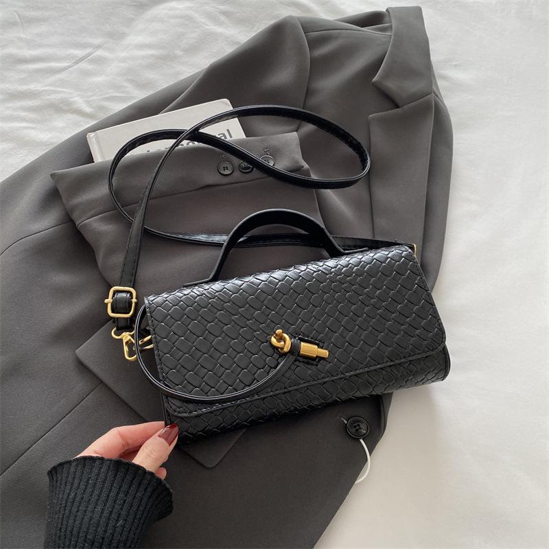 Mode exquisite Weberei 2025 einfarbig lässig Schloss große Kapazität ausländischer Stil horizontal Umhängetasche Baguette Damen Tasche