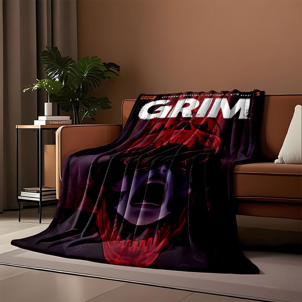 A screaming face framed within a red skull-like shape. for all seasons blanket lunch break throw gift