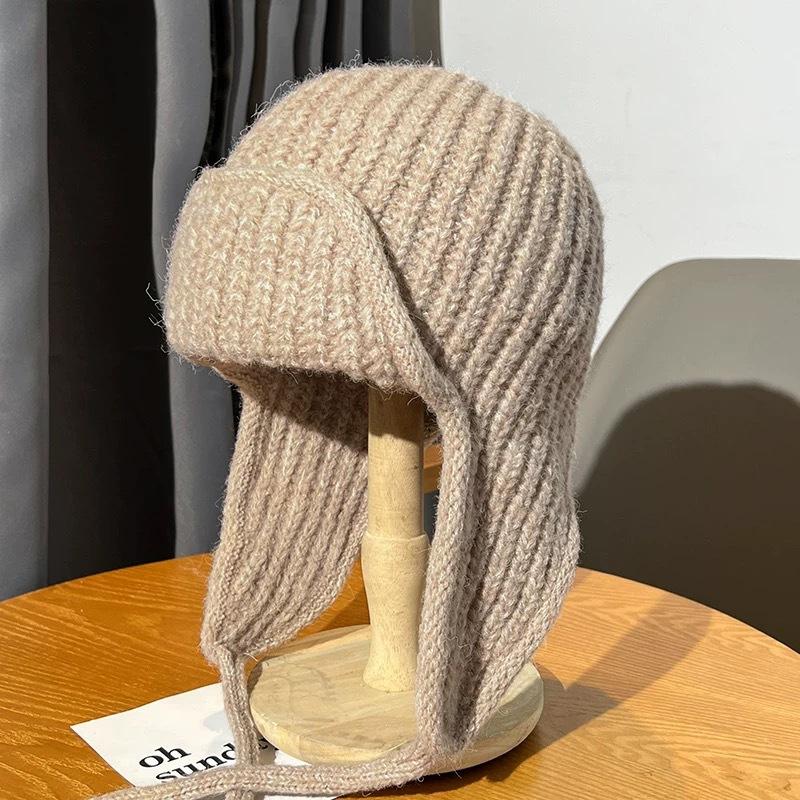 Autumn and winter pink knitted wool hat women's lace-up ear protectors flying hat warm versatile face small ski Lei Feng hat