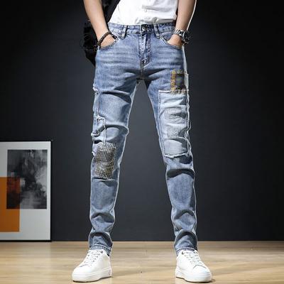 Versão coreana do The Tide Splicing Holes Calças masculinas tipo slim com elástico para pés pequenos, tamanho grande