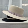 2026 Fine grass woven flat hat women's outing, British style topper women's beach vacation, versatile sun hat