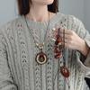 Antique Bronze Feather Necklace: Bohemian Double-Layer Zen Style for Women