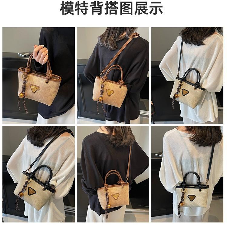 Spring new simple retro hand bucket bag women's shoulder bag high-end texture niche messenger bag