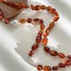 Stylish Red Resin Irregular Bead Necklace With Adjustable Length For Personalized Fit And Artistic Design In Sturdy Alloy Construction.