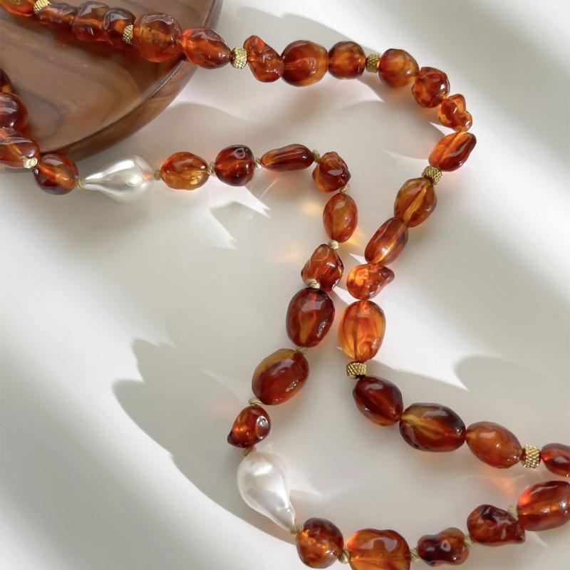 Stylish Red Resin Irregular Bead Necklace With Adjustable Length For Personalized Fit And Artistic Design In Sturdy Alloy Construction.