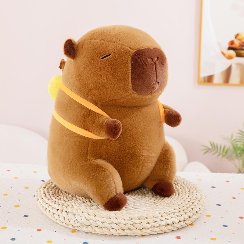 

Плюшевая кукла Капибара: Очаровательная игрушка-подушка-рюкзак и милый подарок 25cm (0.2kg) темно-коричневого