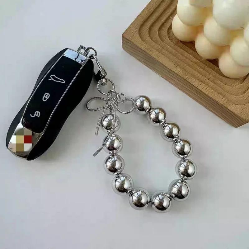 Advanced feeling electroplated silver pearl mobile phone strap, sweet bow headphone case, bag, car key pendant