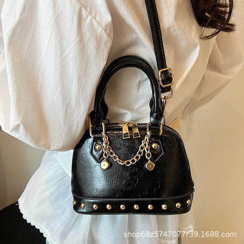 2025 new niche design high-end champagne rivet portable shell bag women's fashionable foreign style shoulder messenger bag