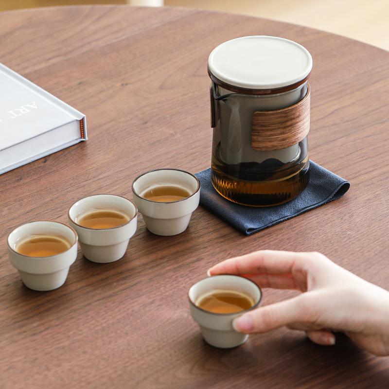 High-end travel tea set, glass, one pot, four cups, outdoor portable leather bag, light luxury business gift box, accompanying gift.