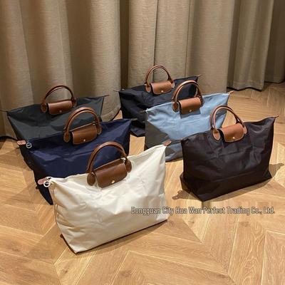 Xiangjia Large-Capacity Waterproof Oxford Travel Tote Bag, Lightweight and Foldable.