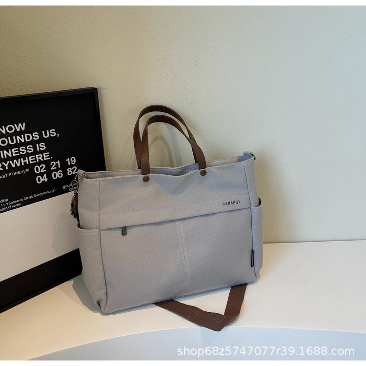 

2025 spring and summer new literary shoulder bag female ins Internet celebrity commuter tote bag large capacity shoulder messenger bag серый