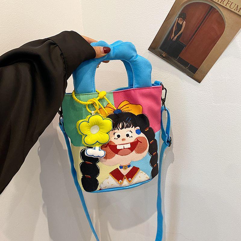 

Cute Illustration Bucket Bags Women s Summer Handbag Graffiti Ins Cartoon Unique Shoulder Bag Canvas Messenger Bag Braid girl + flower pendant