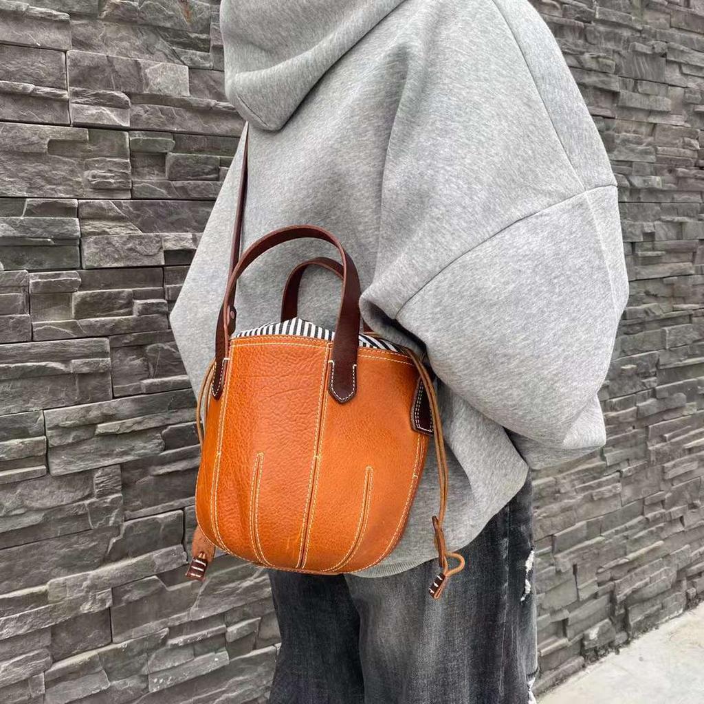 Top Layer Vegetable Tanned Cowhide Bucket Bag Retro Personalized Bucket Bag Drawstring Pumpkin Bag Niche Design Crossbody Bag