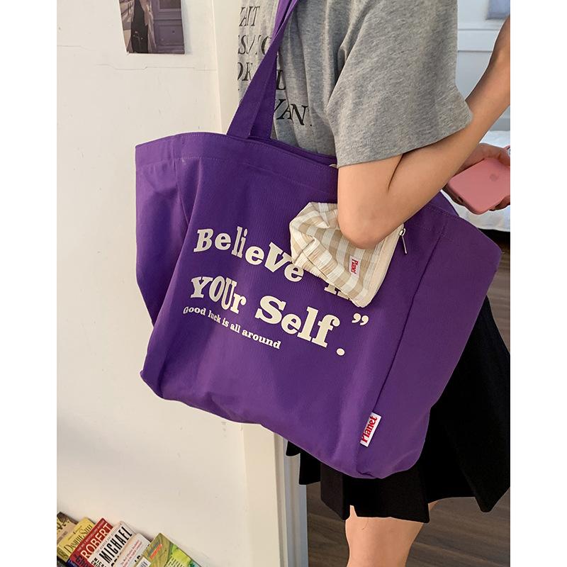 

Korean version of large-capacity alphabet canvas bag women s 2025 new fashion preppy style tote bag casual shoulder bag фиолетовый