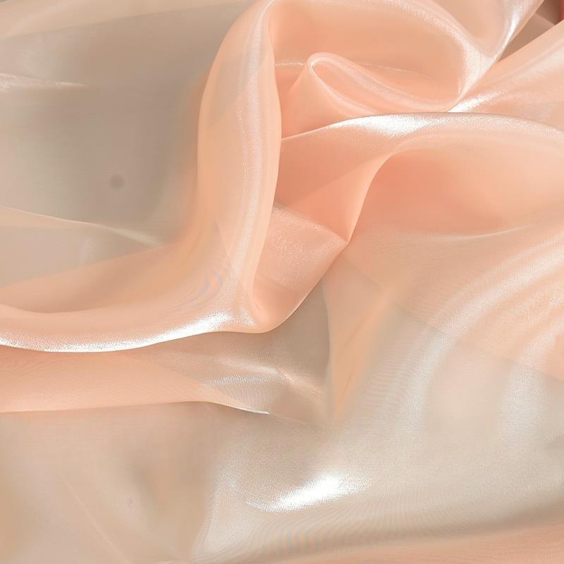 Shimmering satin encrypted solid color organza fabric suitable for wedding dresses formal gowns and designer clothing fabrics
