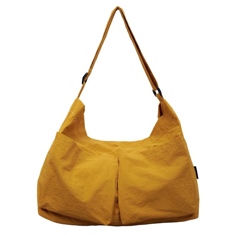 

Korean version of fashionable solid color shoulder bag 2025 autumn new large-capacity retro messenger bag casual double pocket canvas bag жовтий